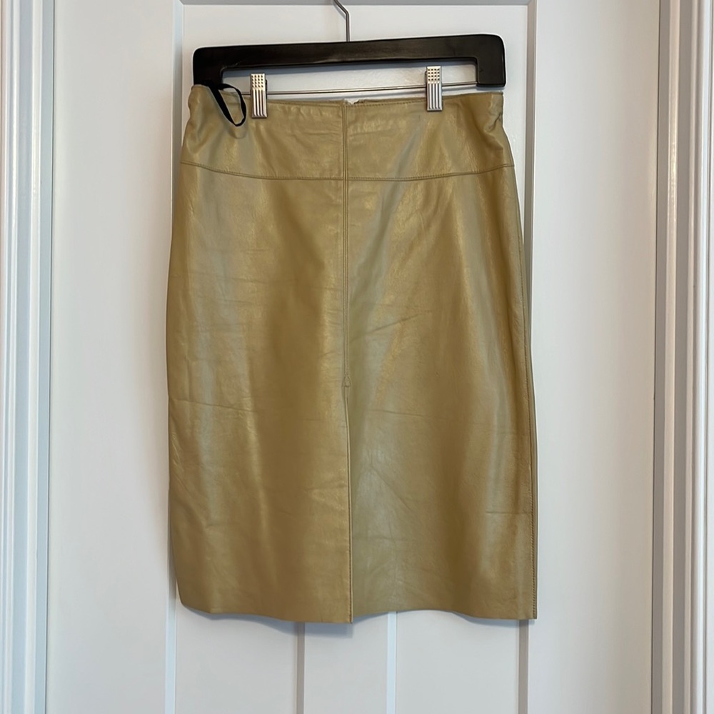 BeBe women’s leather skirt. Size 6. NWT. Tan in color. Super cute!!!